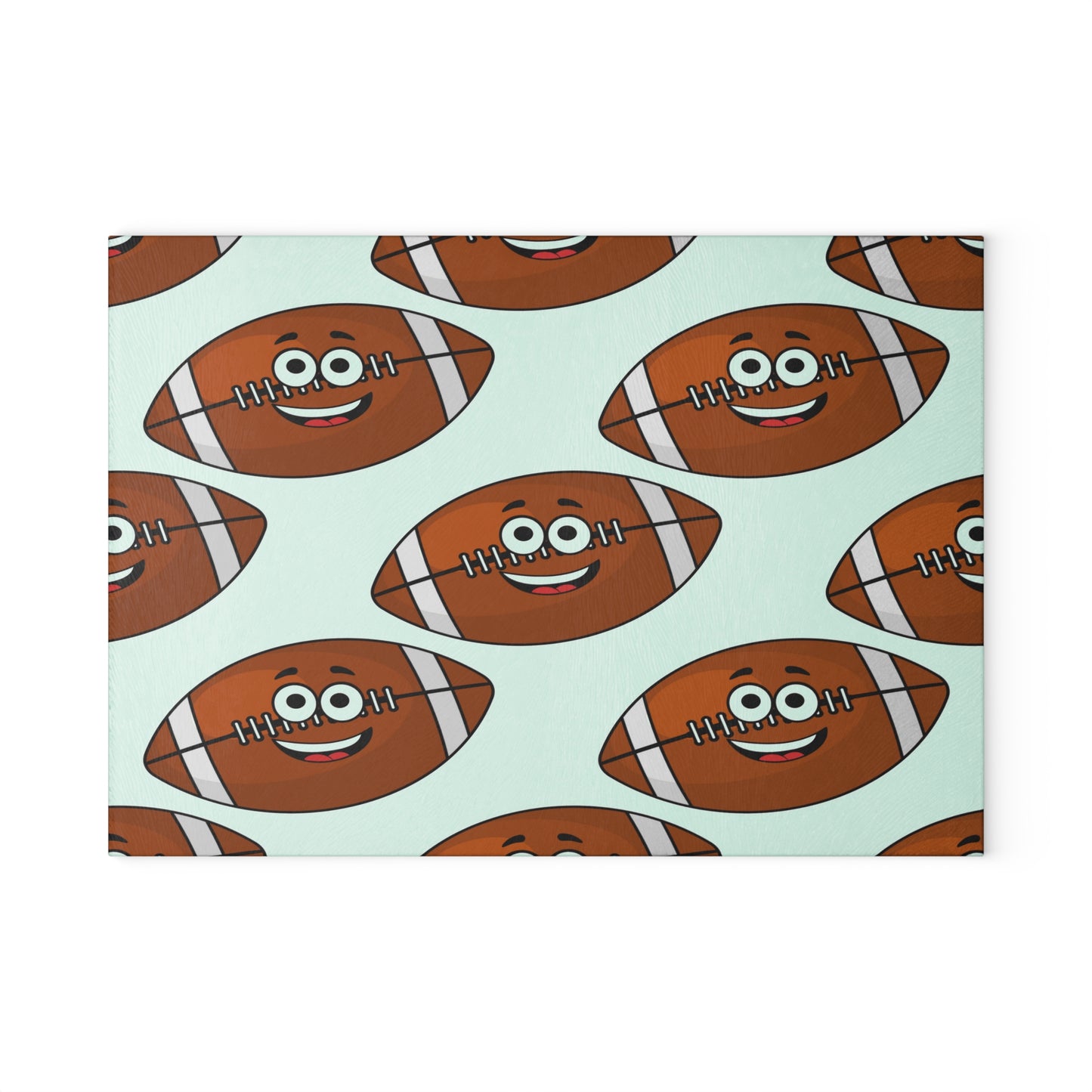 Brighten your kitchen with the Printify Playful Football-Faces Cutting Board: Glass. This fun design features cartoon footballs with smiling faces and big eyes, making meal prep playful and stylish. Available in 2 sizes.