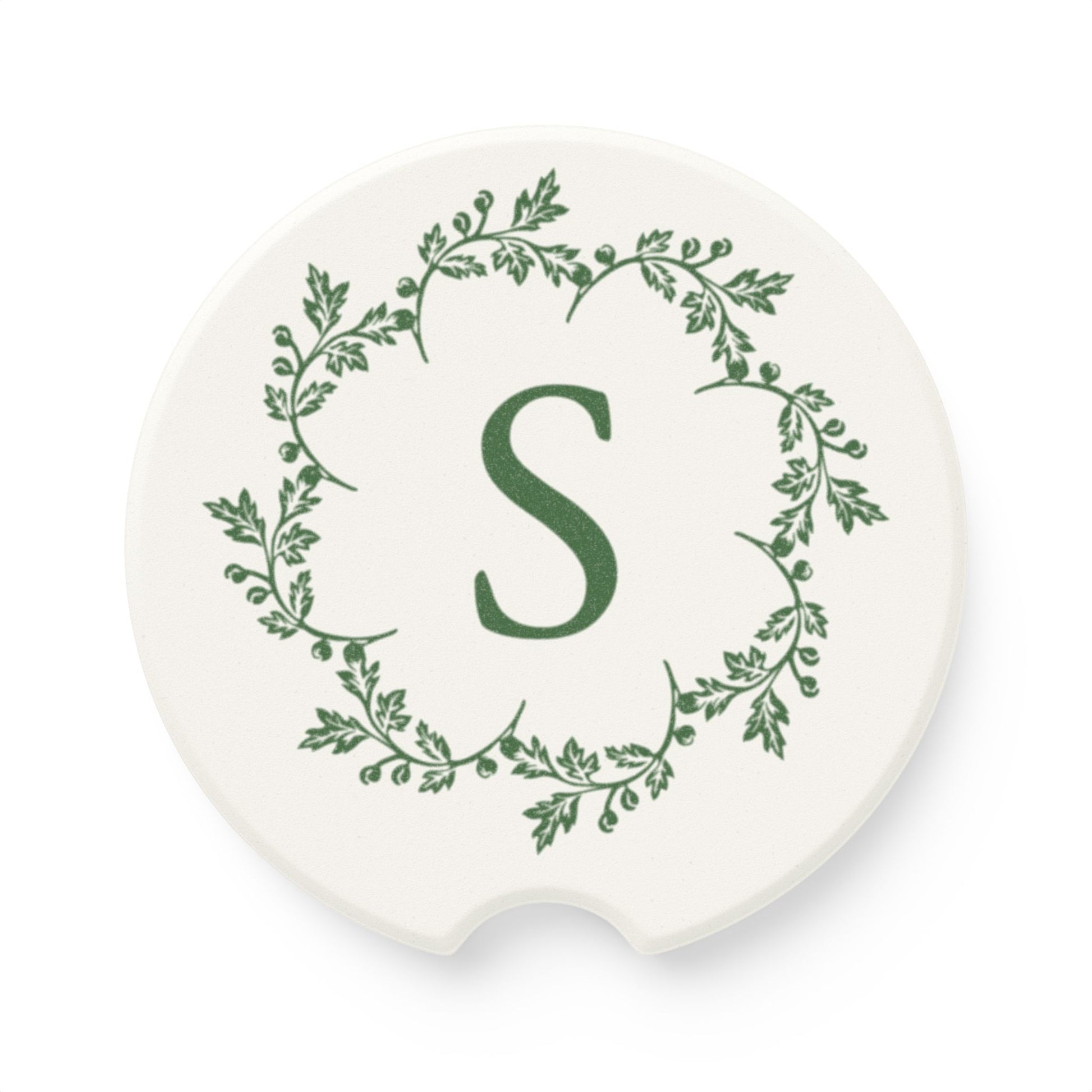 Printify's Personalized Car Coasters are crafted from white ceramic and feature an elegant design with a central green letter "S" encircled by a leafy pattern. These absorbent coasters make a charming car accessory, adding a unique touch of style to your vehicle's interior.