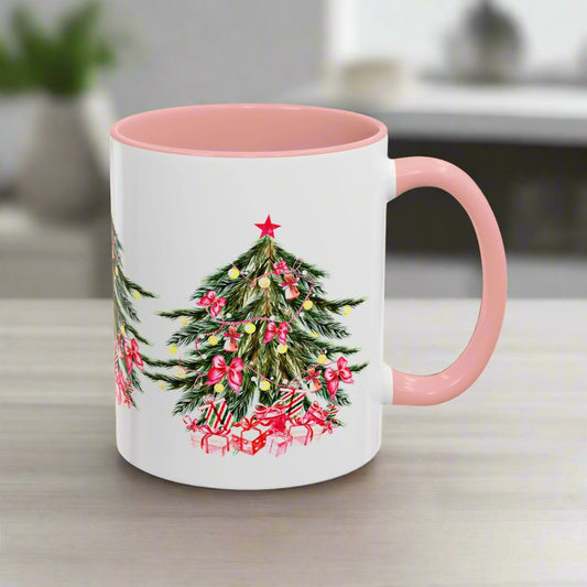 The Festive Christmas-Tree Coffee-Mug by Printify features a charming white and pink design with a holiday tree, adorned with red bows, a star on top, and surrounded by wrapped presents at its base. Available in 11 oz. and 15 oz. ceramic options, this mug makes for a perfect gift.