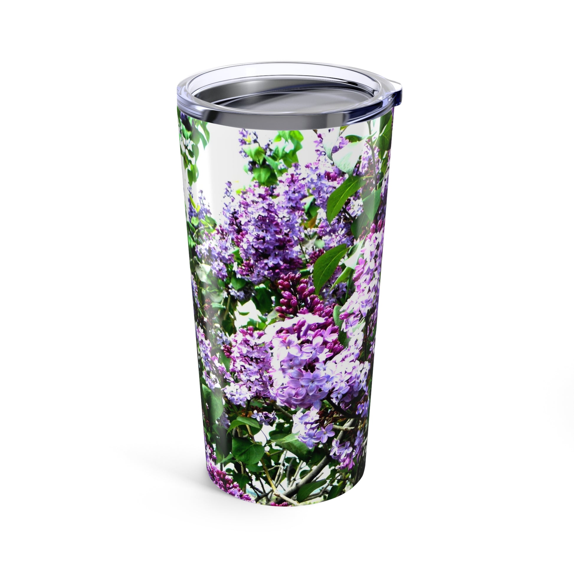 The Printify Purple Lilacs Tumbler is a 20 oz. insulated stainless steel travel mug with a clear plastic lid, featuring a vibrant purple and green lilac flower design.