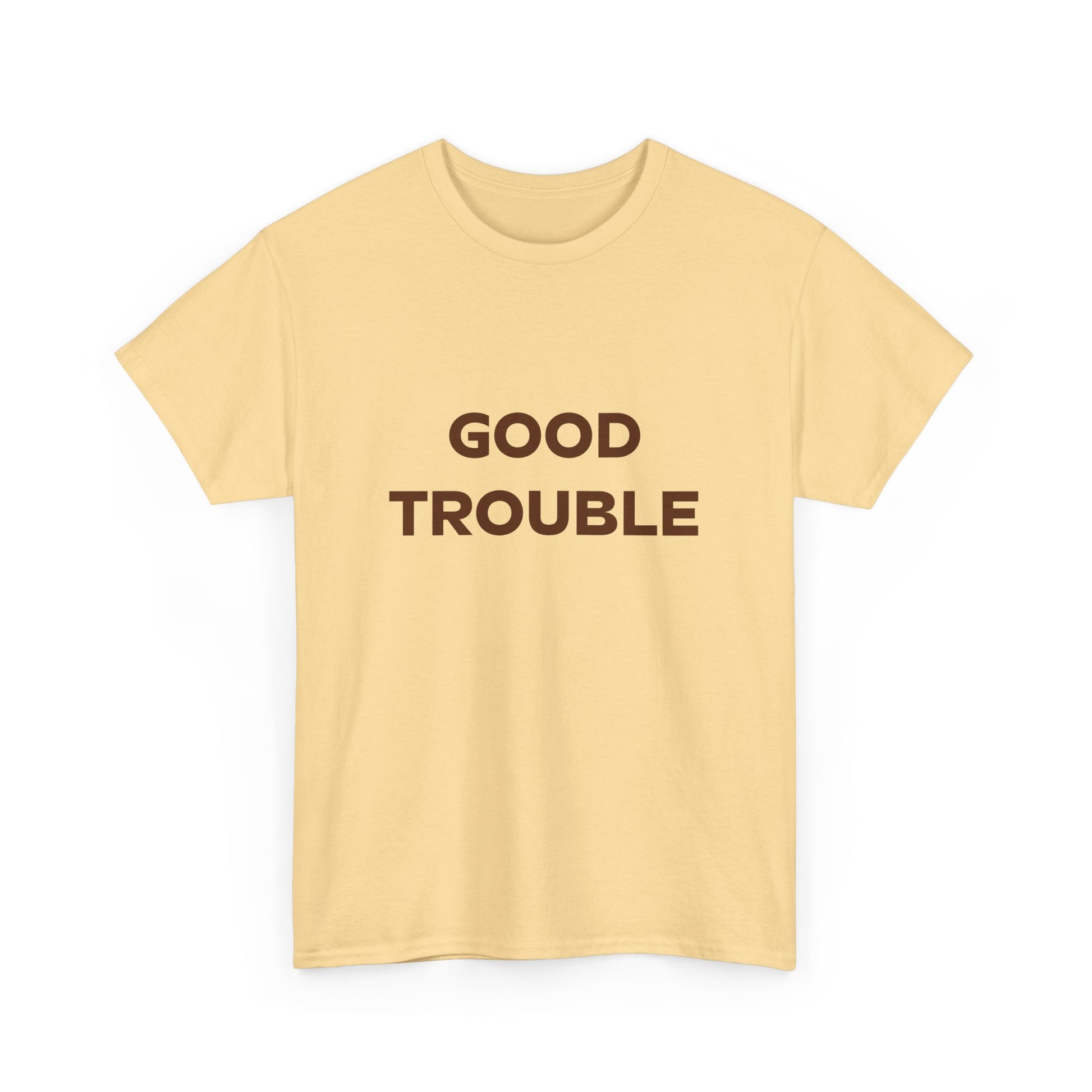 The Printify Good Trouble Unisex T-shirt features bold brown "GOOD TROUBLE" lettering on light yellow cotton, making it a perfect statement or protest shirt. Available in 3 colors from Gildan.