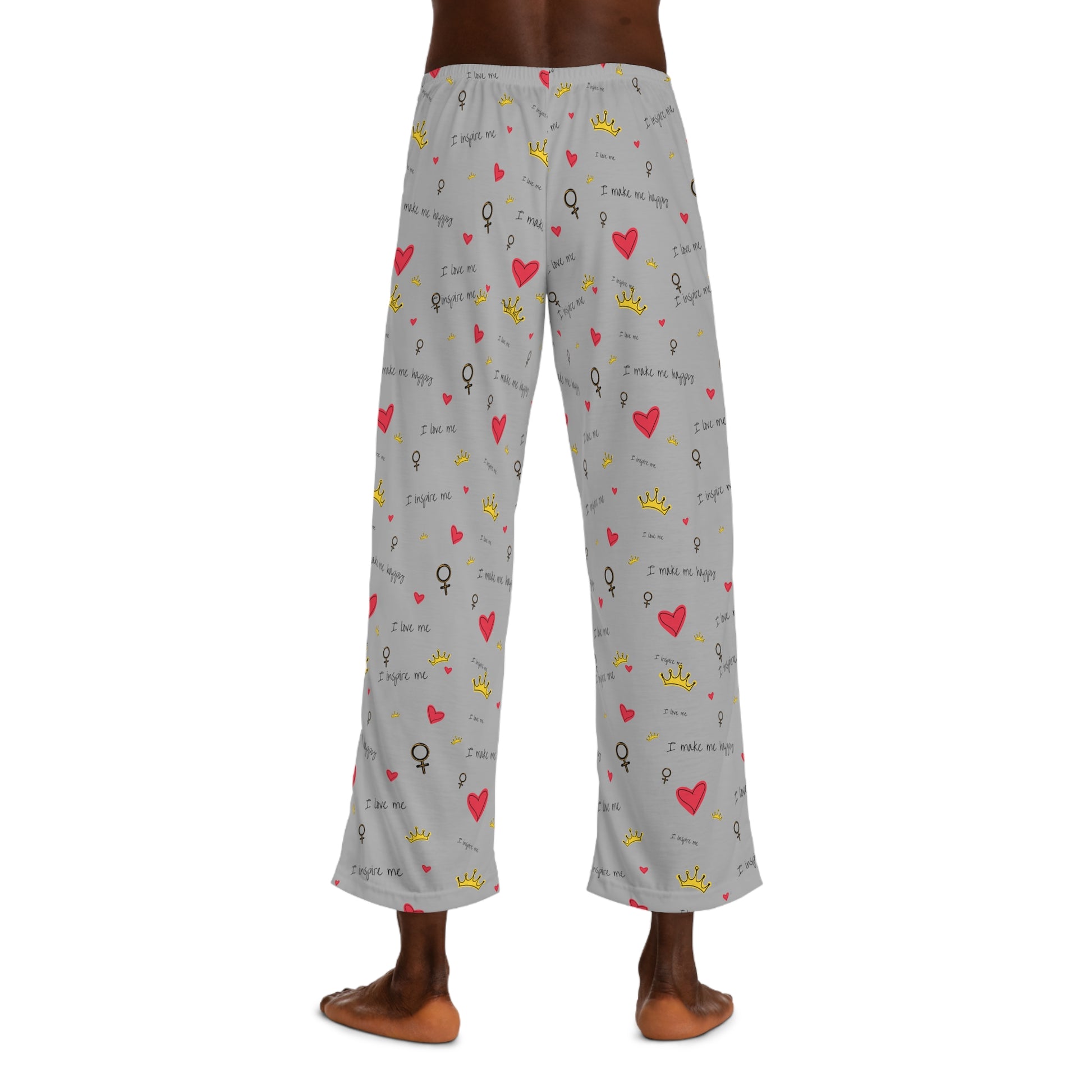 A man wearing Printify Men's Pajama Pants: Polyester jersey; Relaxed fit; Elastic; Drawstring with hearts on them made of 100% polyester.