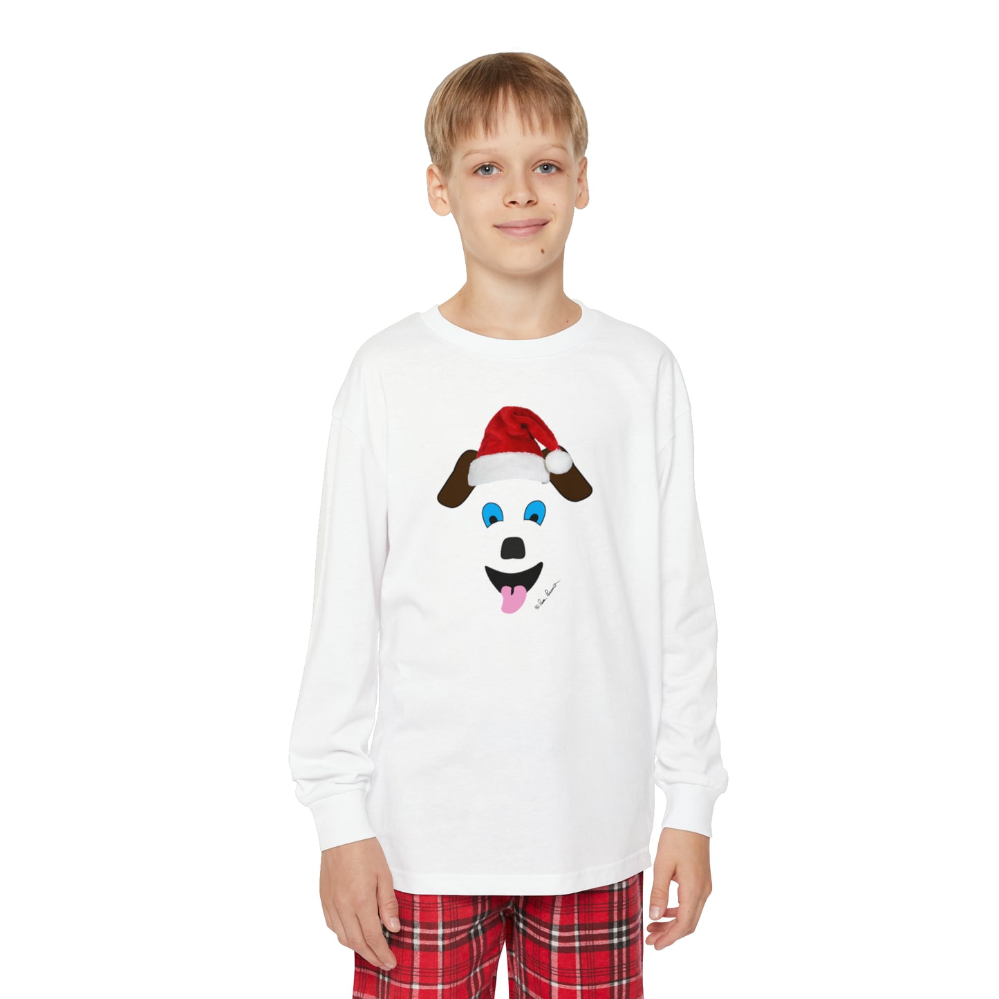 A youth in a Printify Red Plaid Youth Long-Sleeve Pajama Set and a santa hat.