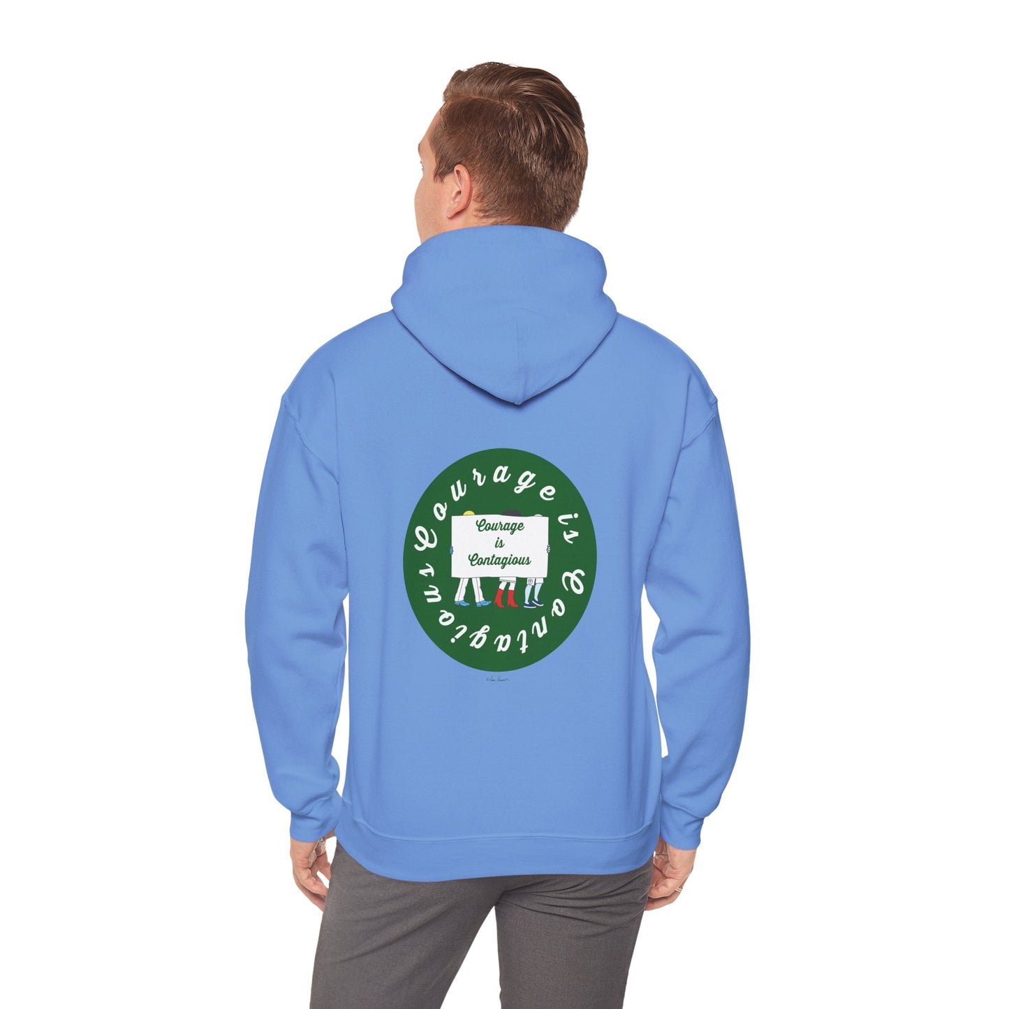 Someone wears a Printify Courage Is Contagious Hoodie: Mental Health Awareness—a blue, mid-weight hoodie with a back circular graphic saying "Courage is contagious" and "Change Encourages," featuring three illustrated people.