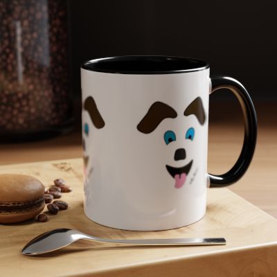 The Printify Playful Dog-Face Coffee Mug—Ceramic and cartoon-themed—rests on a wooden surface beside a spoon, macaron, and coffee beans; it’s the ultimate fun gift for any pet lover.