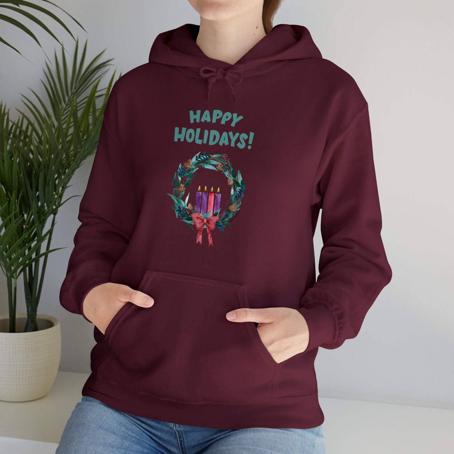 Mock up of a woman sitting down and wearing the Maroon shirt