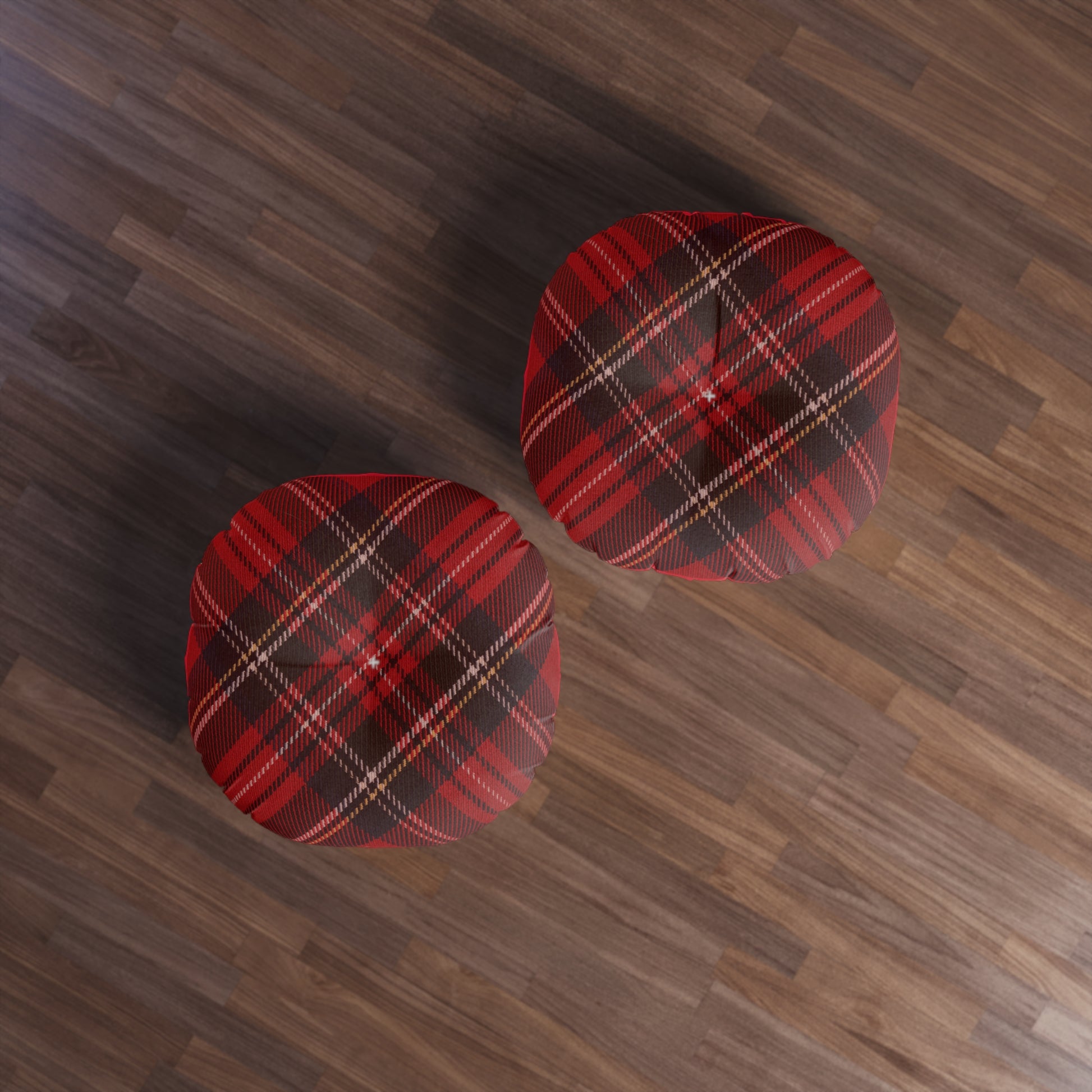 Two comfortable Printify Plaid Tufted Floor-Pillows on a wood floor.