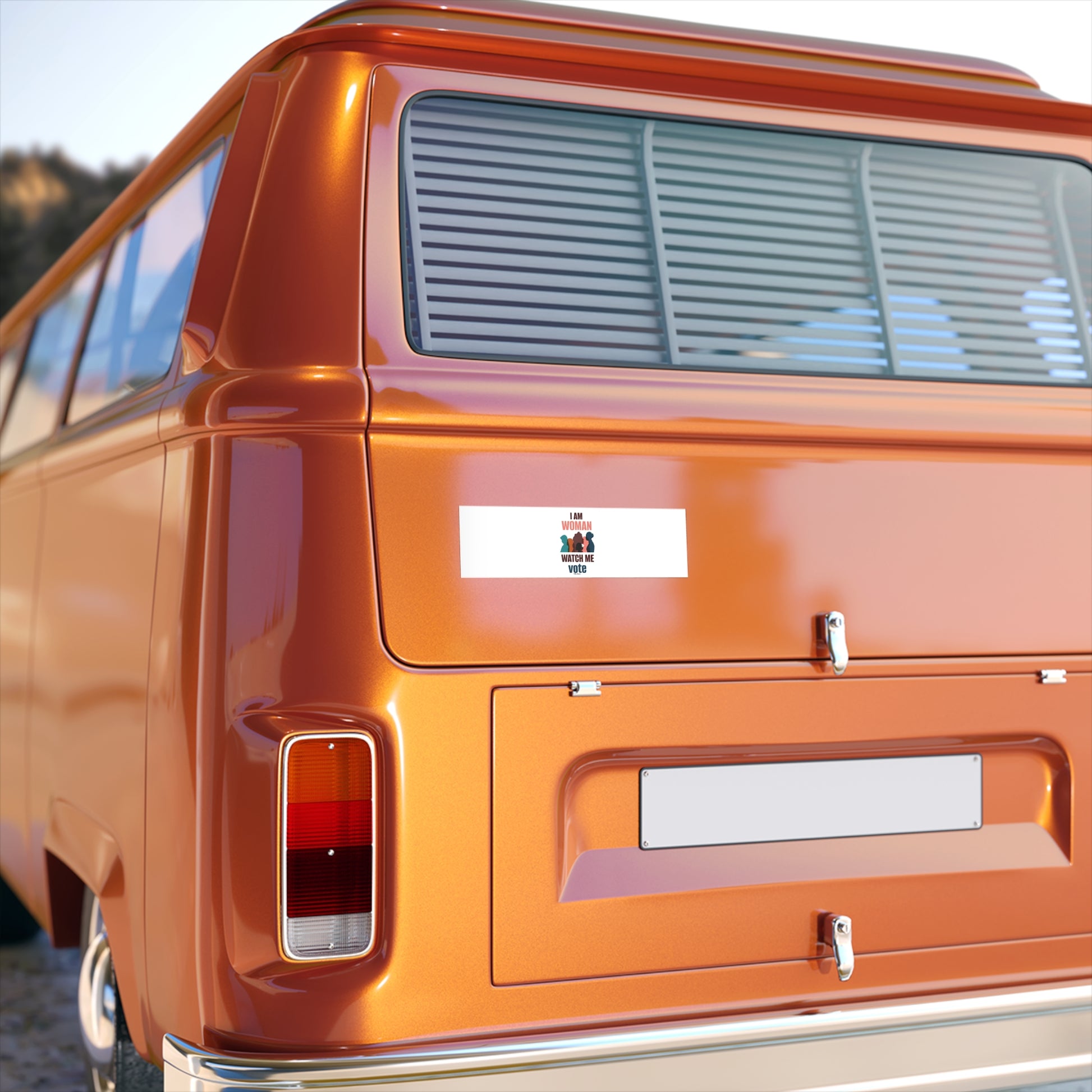 Rear view of an orange vintage van with a Canadian flag decal and Printify Voting Women's Bumper Stickers on the back window, and a blank license plate.