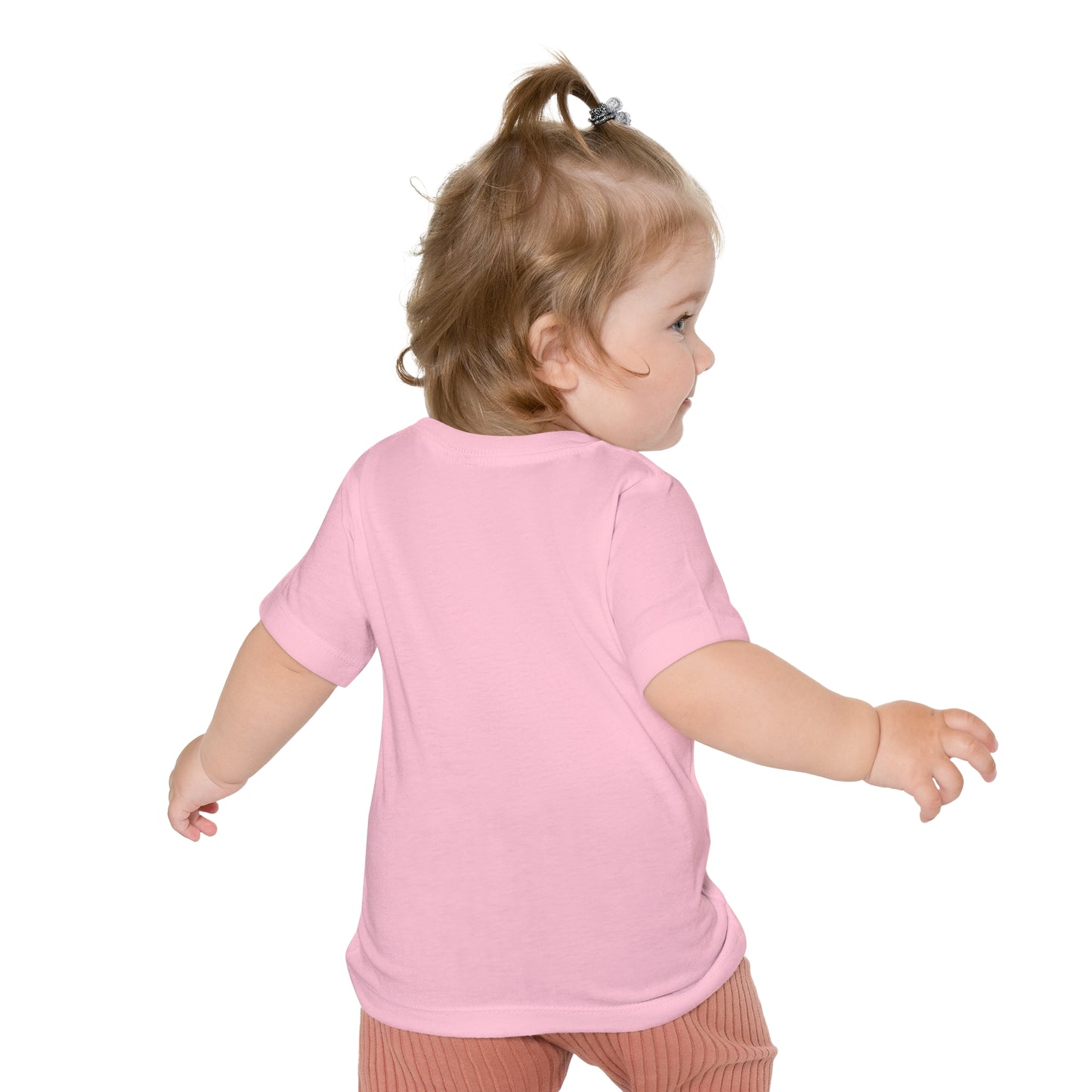 Toddler in a pink Printify Unisex Baby's Easter-Gnome T-shirt and striped pants viewed from behind.