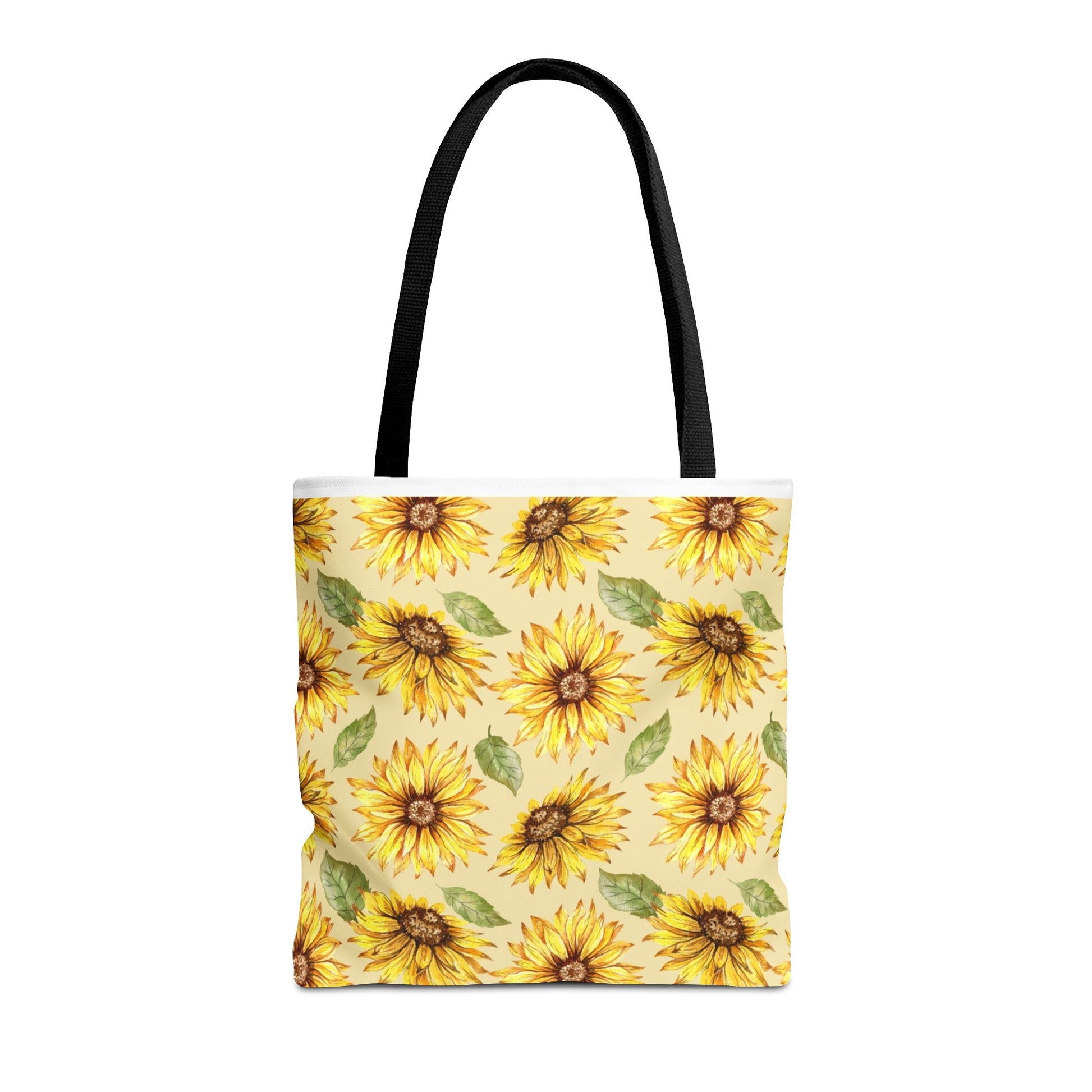 A Yellow Floral Tote Bag by Printify with a sunflower print on a light yellow background, featuring black handles and assembled in the USA.