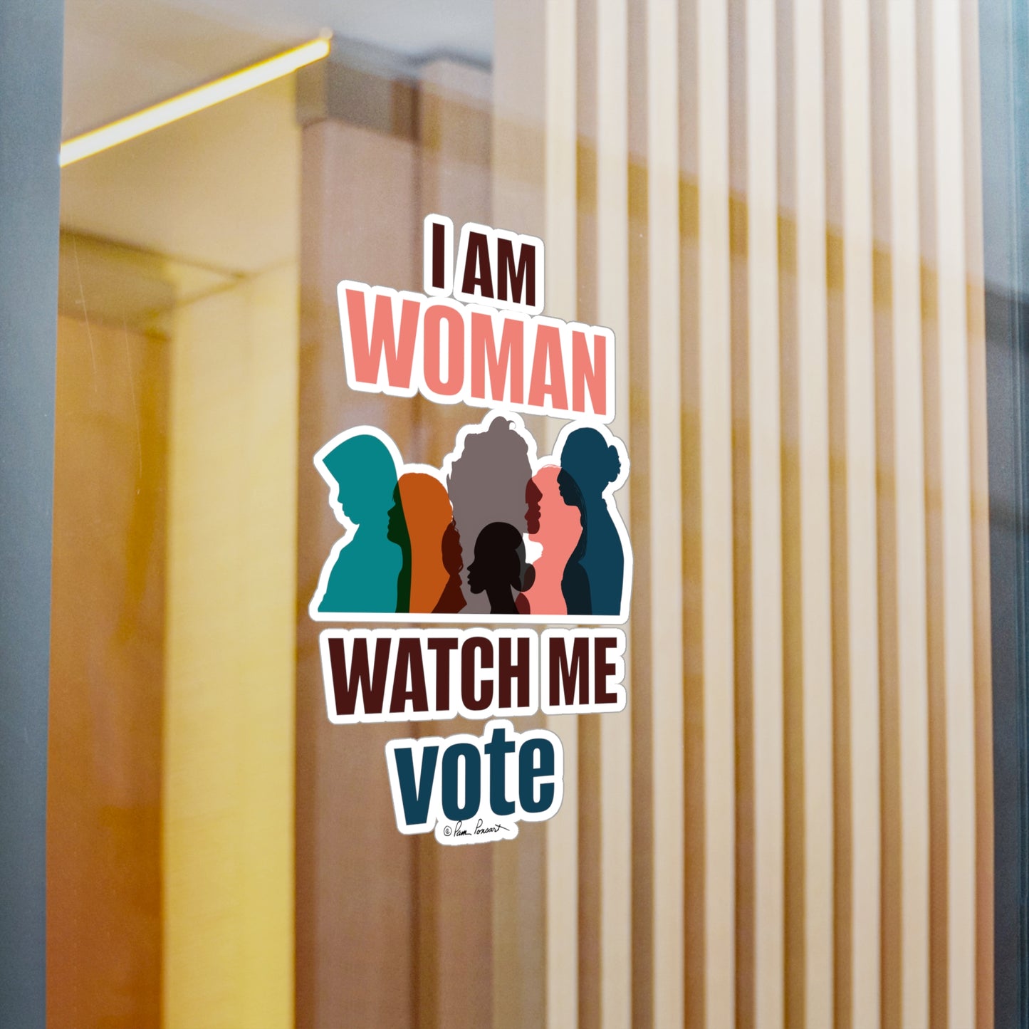 A removable adhesive Voting Women's Decal on a glass door with the text "i am woman watch me vote" surrounded by silhouettes of diverse women's profiles, crafted from white vinyl by Printify.