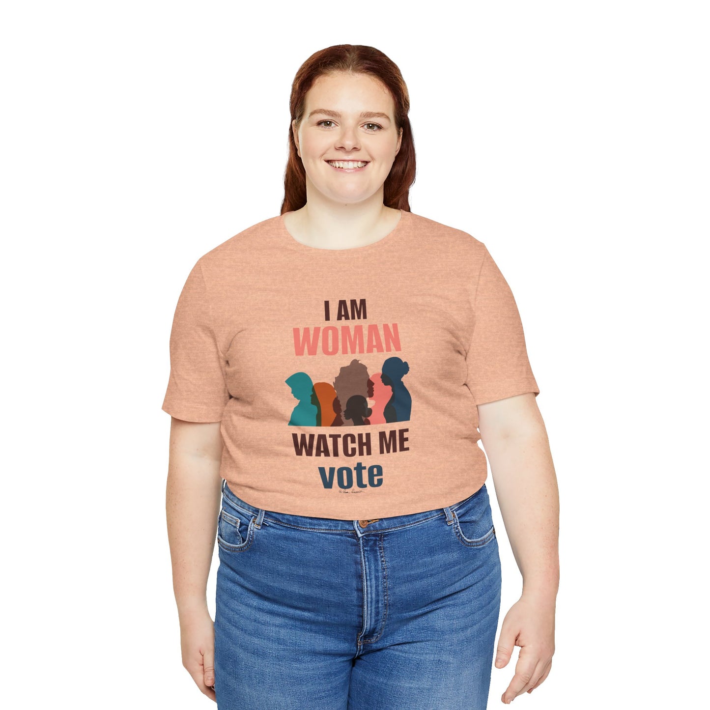 A woman in a Printify Bella + Canvas Voting Women's T-shirt with "i am woman watch me vote" and silhouette graphics, paired with blue jeans, smiling at the camera.