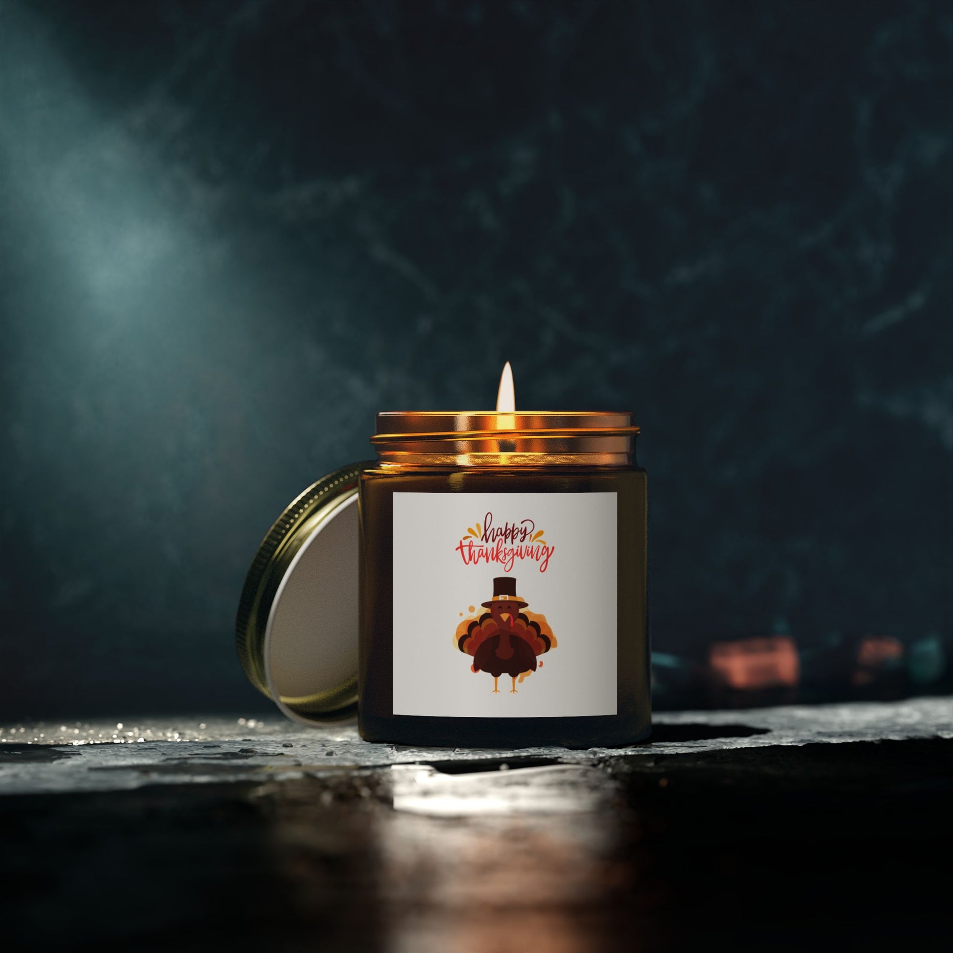 The Printify Thanksgiving Scented Candle, 4 oz., 20-hour burn in a brown glass jar with a “Happy Thanksgiving” turkey label, sits on dark stone. Made with eco-friendly Coconut Apricot Wax for a festive holiday touch.