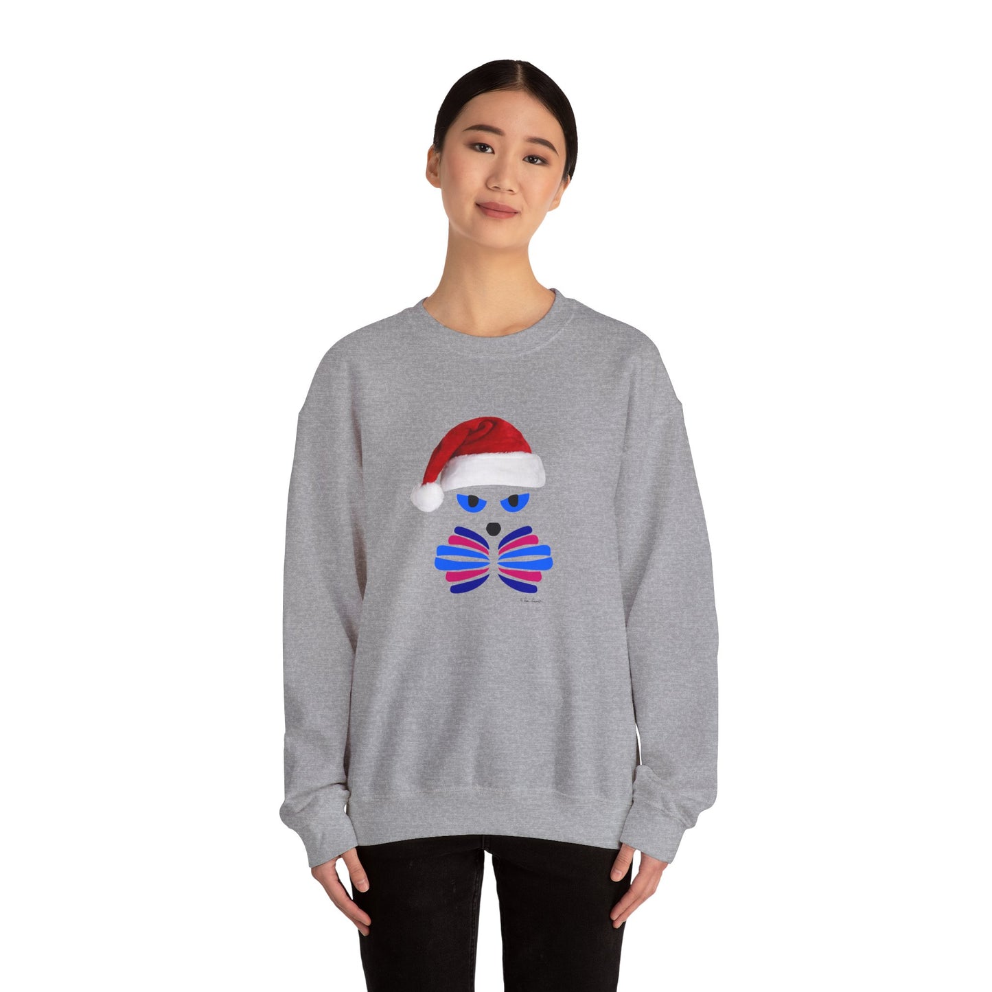 A person wears the Printify Santa Cat Sweatshirt—unisex, crewneck, festive graphic of a cat face with a Santa hat—standing against a plain white background.
