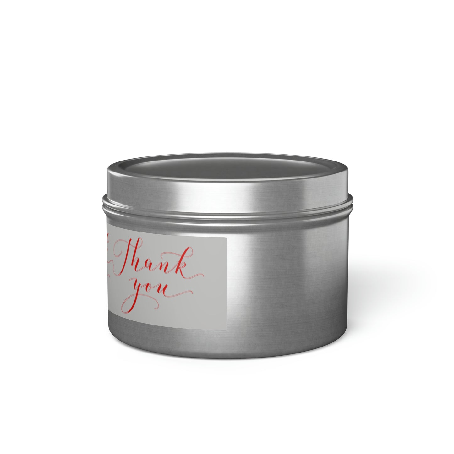 A Printify silver tin with the words thank you on it containing a Printify scented tin candle.