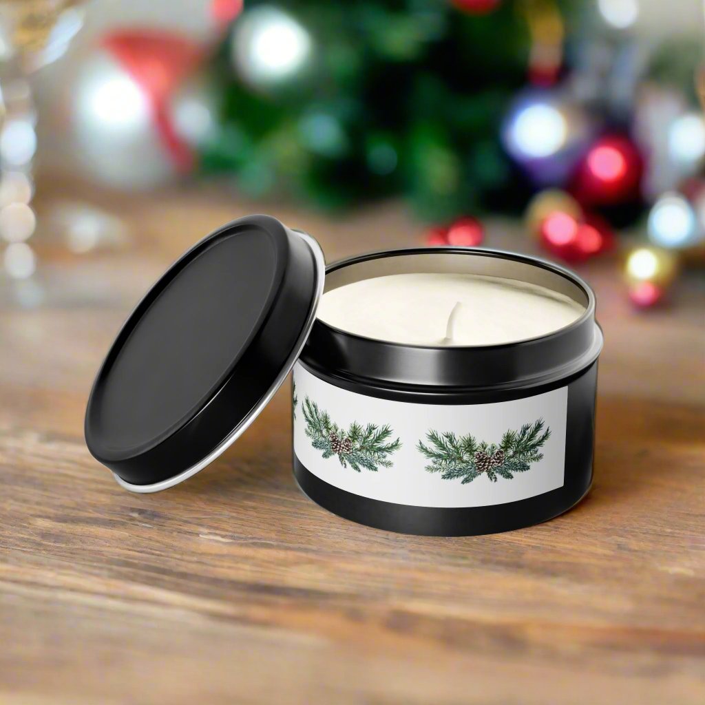 A Holiday-Inspired Pinecone Tin-Candle from Printify, featuring an Evergreen scent and a white, pine-themed label, sits open on a wooden table, releasing its soothing fragrance. Blurred Christmas ornaments in the background enhance the charm of these eco-friendly 4 oz. candles.