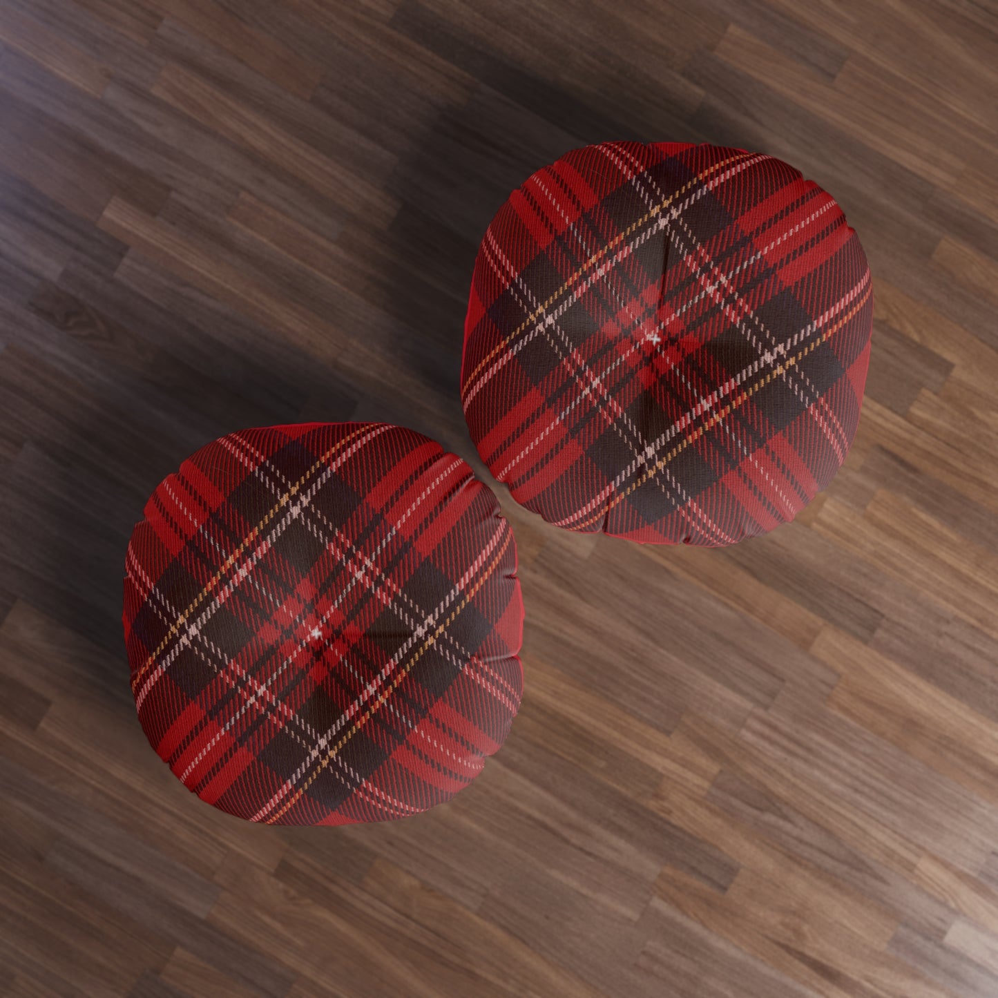 Two comfortable Printify plaid tufted floor pillows on a wooden floor.
