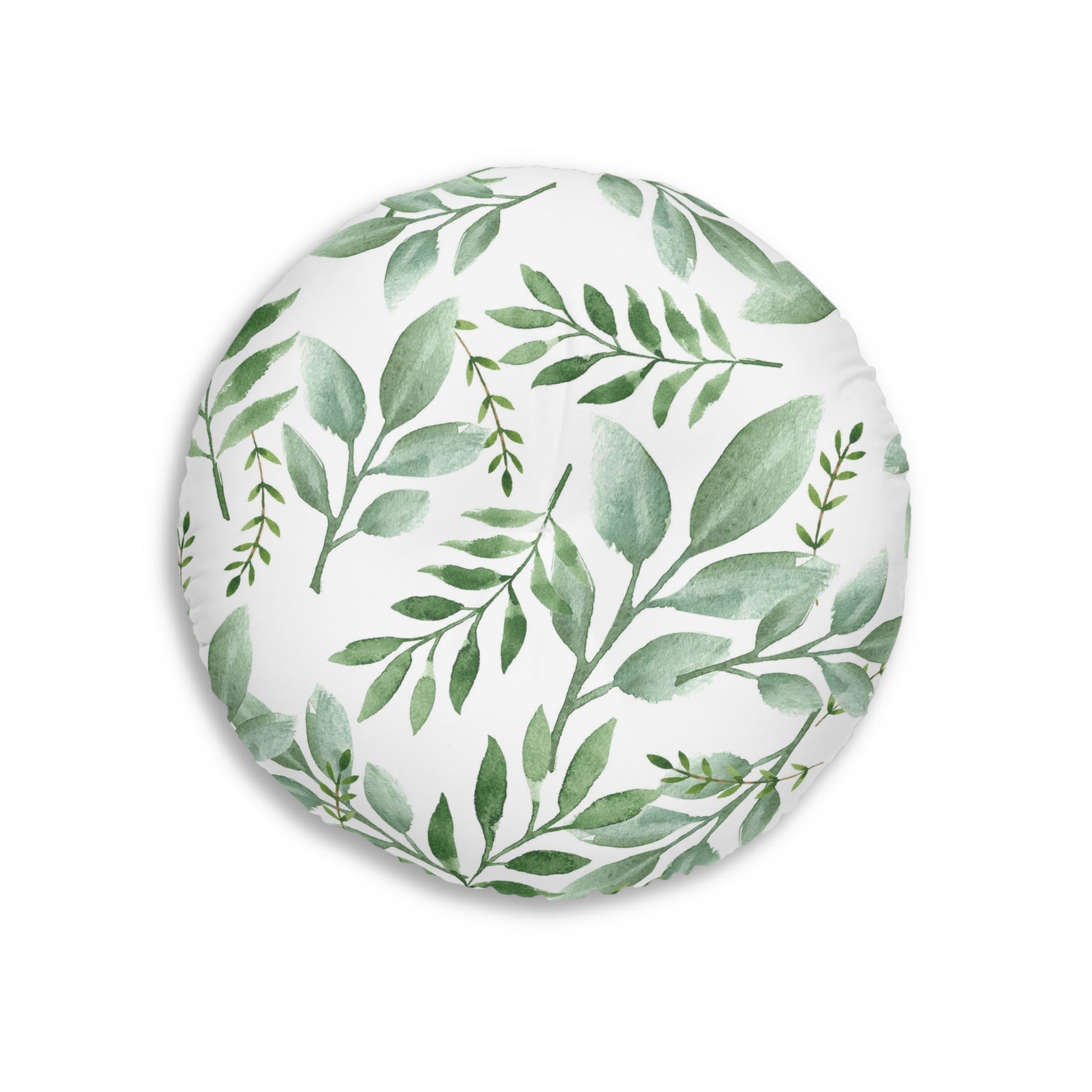 A Printify round tufted floor-pillow with a pattern of green botanical design leaves and branches, made in America.