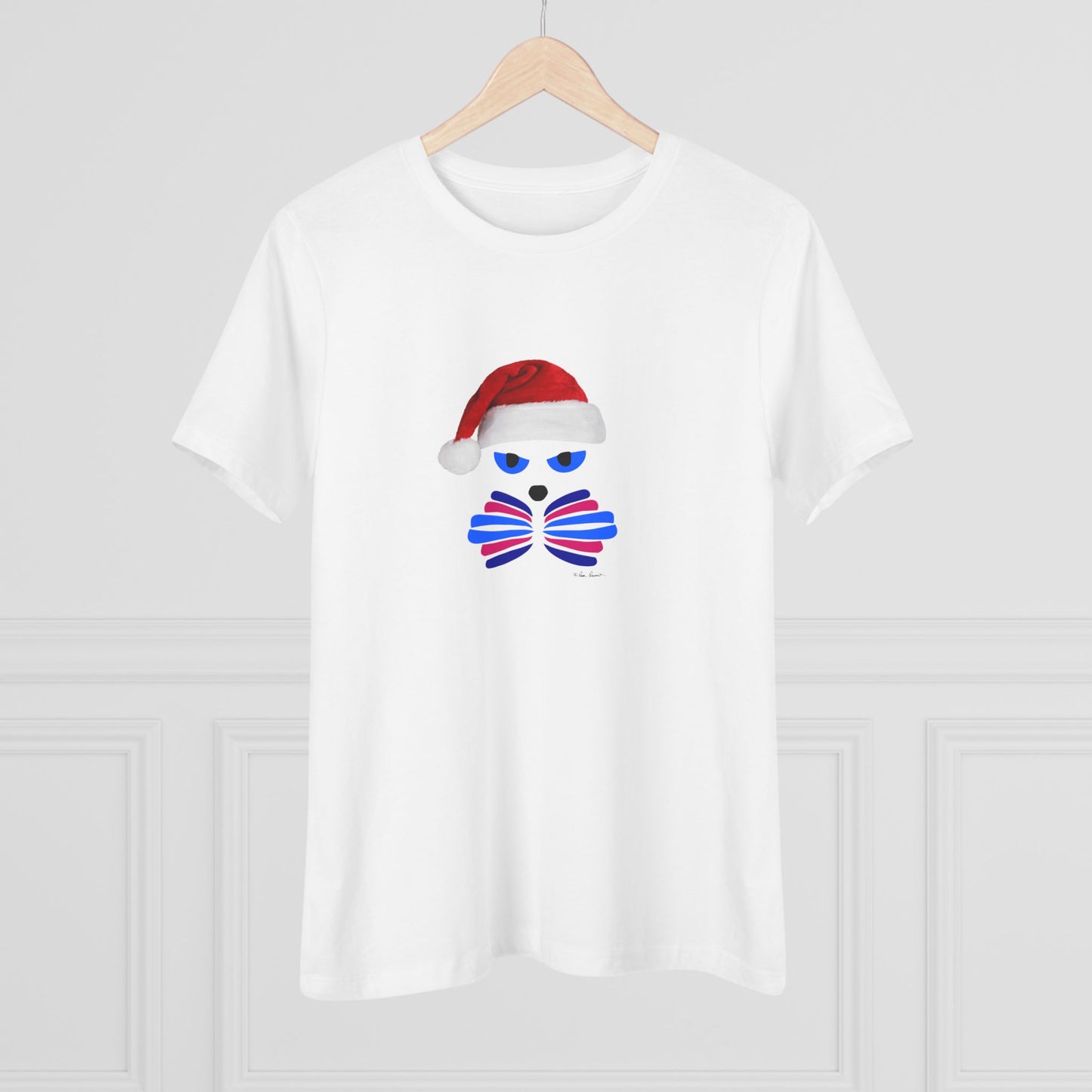 Printify’s Festive Women's Santa-Cat T-shirt features a cute stylized face with blue eyes and a red Santa hat, in soft cotton and 2 colors—perfect for the holidays, shown here on a hanger against a simple white background.
