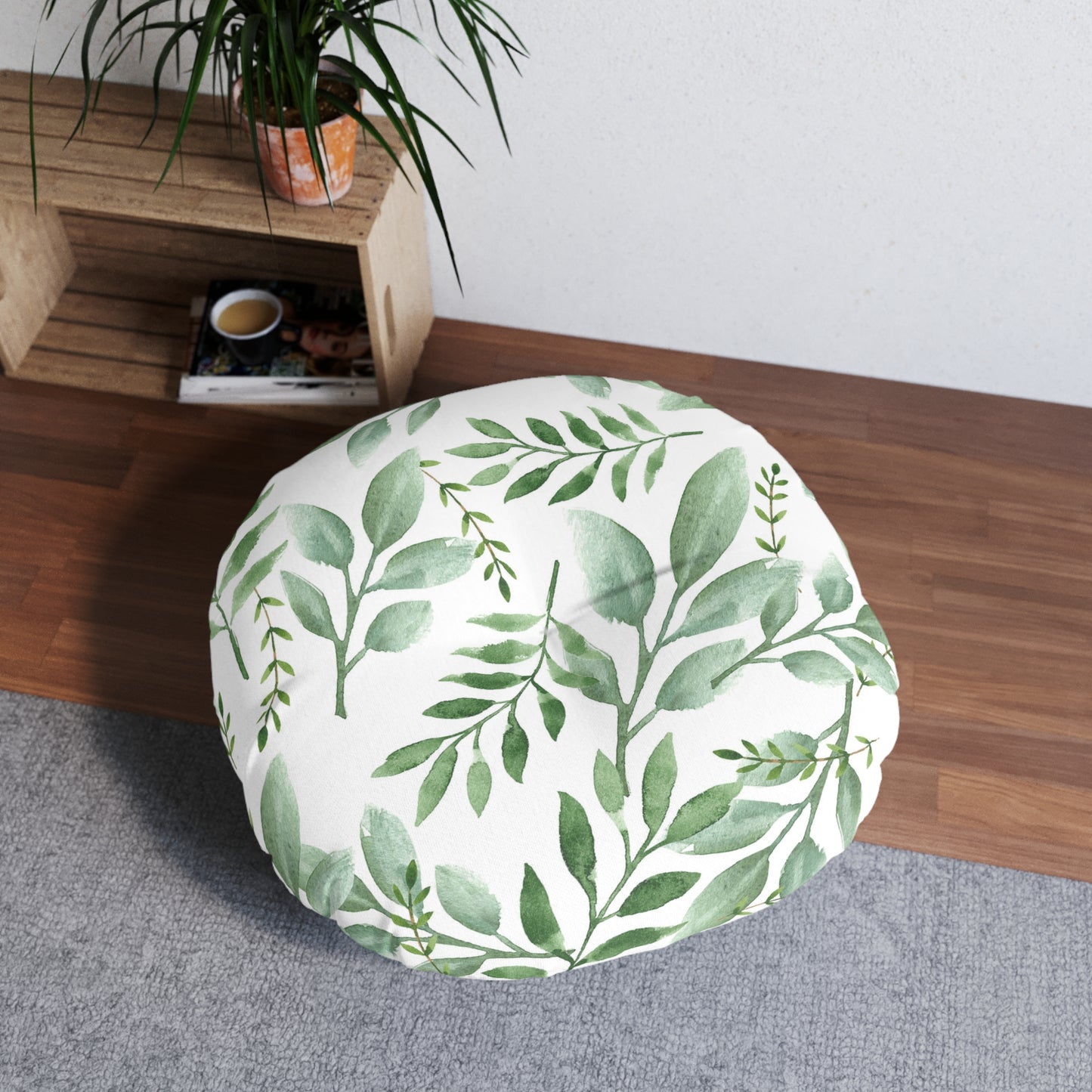Printify's Round Tufted Floor-Pillow with a green botanical design on a wooden bench, made in America.