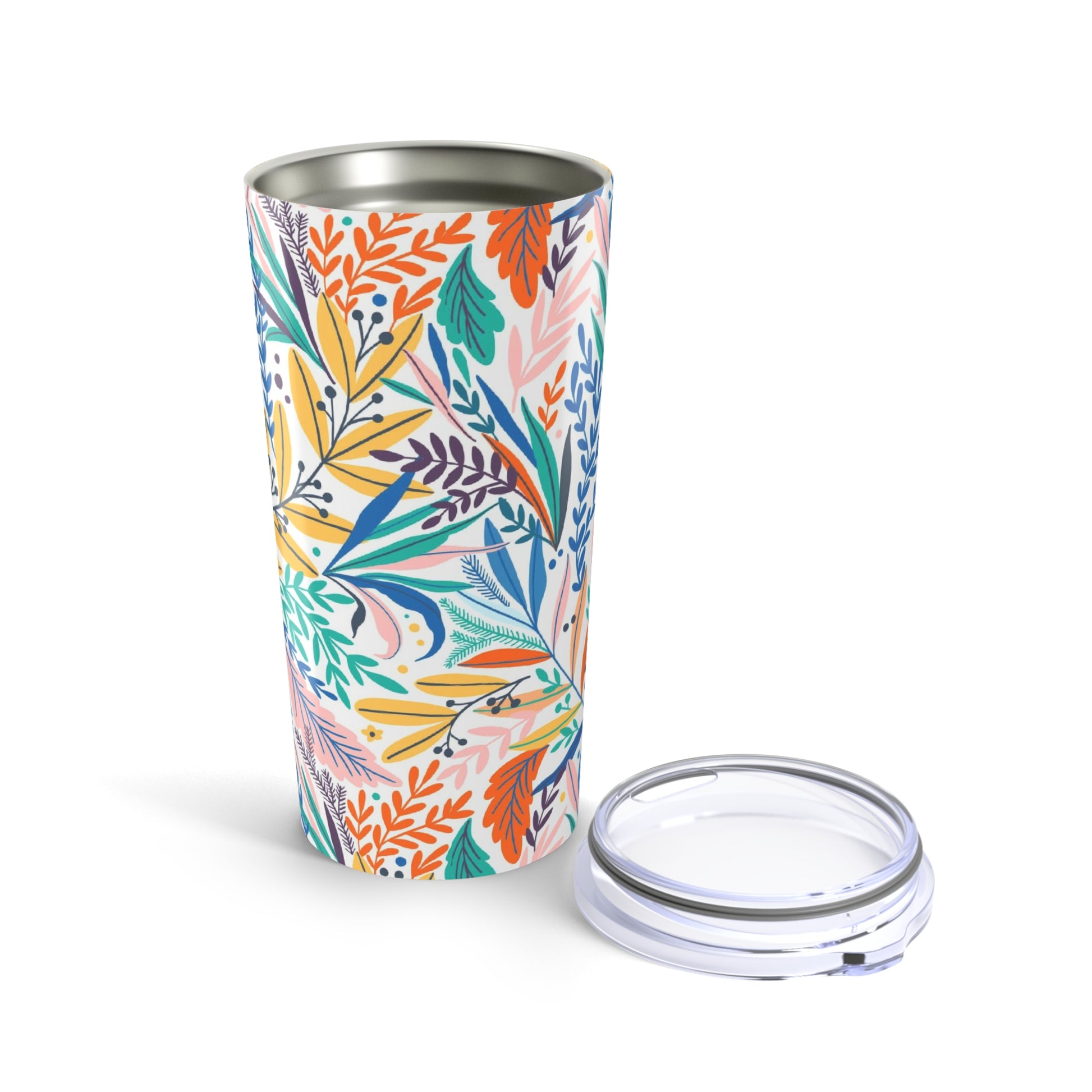 The Lunch Bag Pal Tumbler by Printify (20 oz., stainless steel) is shown with its transparent lid; the stylish design features a vibrant floral pattern against a white background.