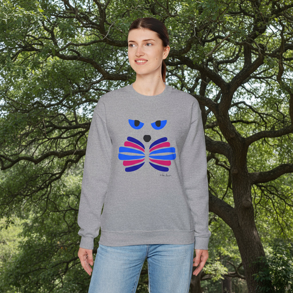 A person stands outdoors by a large tree, wearing blue jeans and the Printify Whimsical Cat Graphic Sweatshirt—an artful, cozy unisex crewneck.