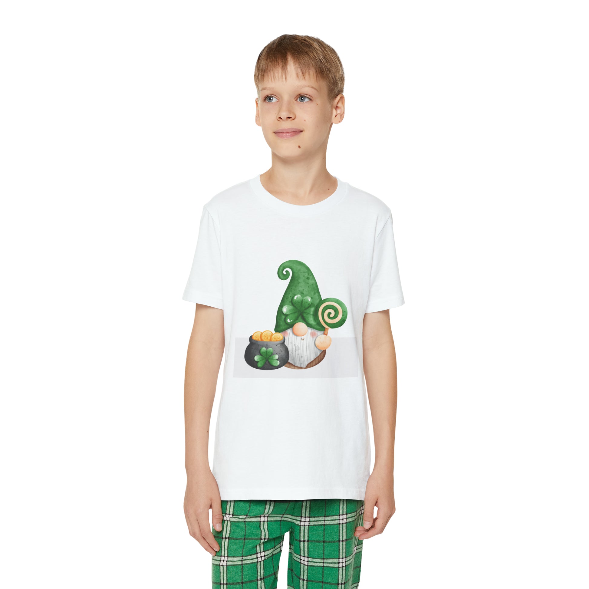 A young boy in a Printify Youth Unisex Pajama-Set with Short Sleeve and a green gnome image on his t-shirt.
