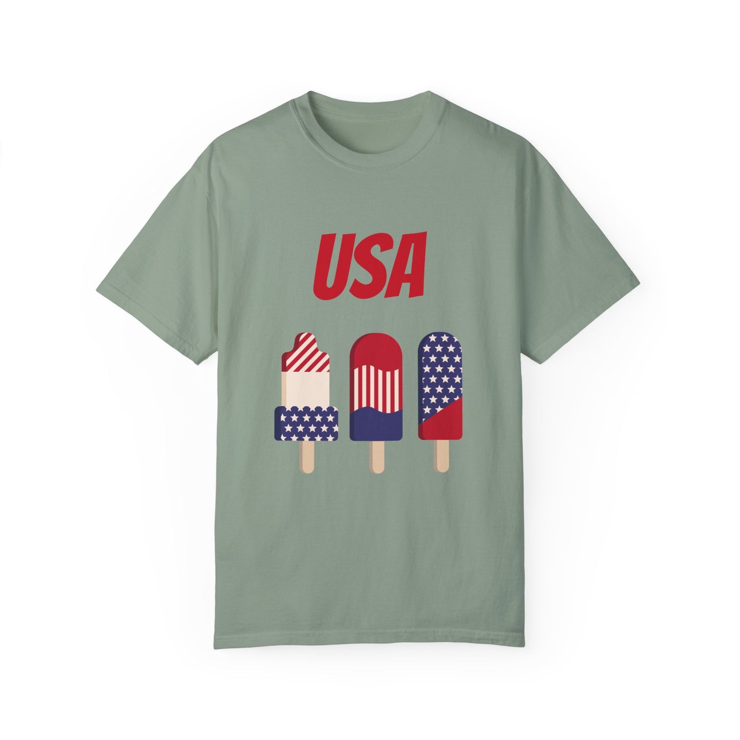 A green Unisex USA T-shirt: 3 colors; Cotton; Comfort Colors 1717 featuring "USA" in red text above three popsicles decorated with stars and stripes in red, white, and blue. Made from 100% ring-spun cotton, this Printify tee ensures a soft, durable feel.