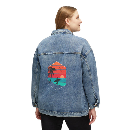 Woman wearing an oversized Printify Surfer-Girl Denim Jacket with a colorful tropical beach graphic on the back.