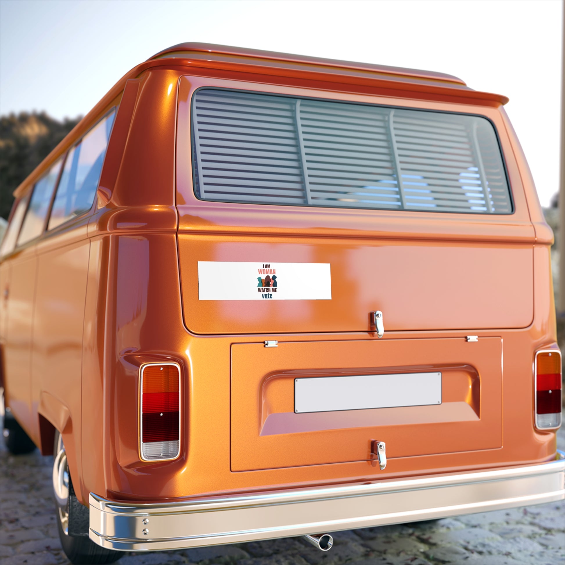 Rear view of a shiny orange vintage van with distinctive rounded edges, featuring Printify's premium water-resistant vinyl bumper stickers for voting women's rights, parked outdoors.