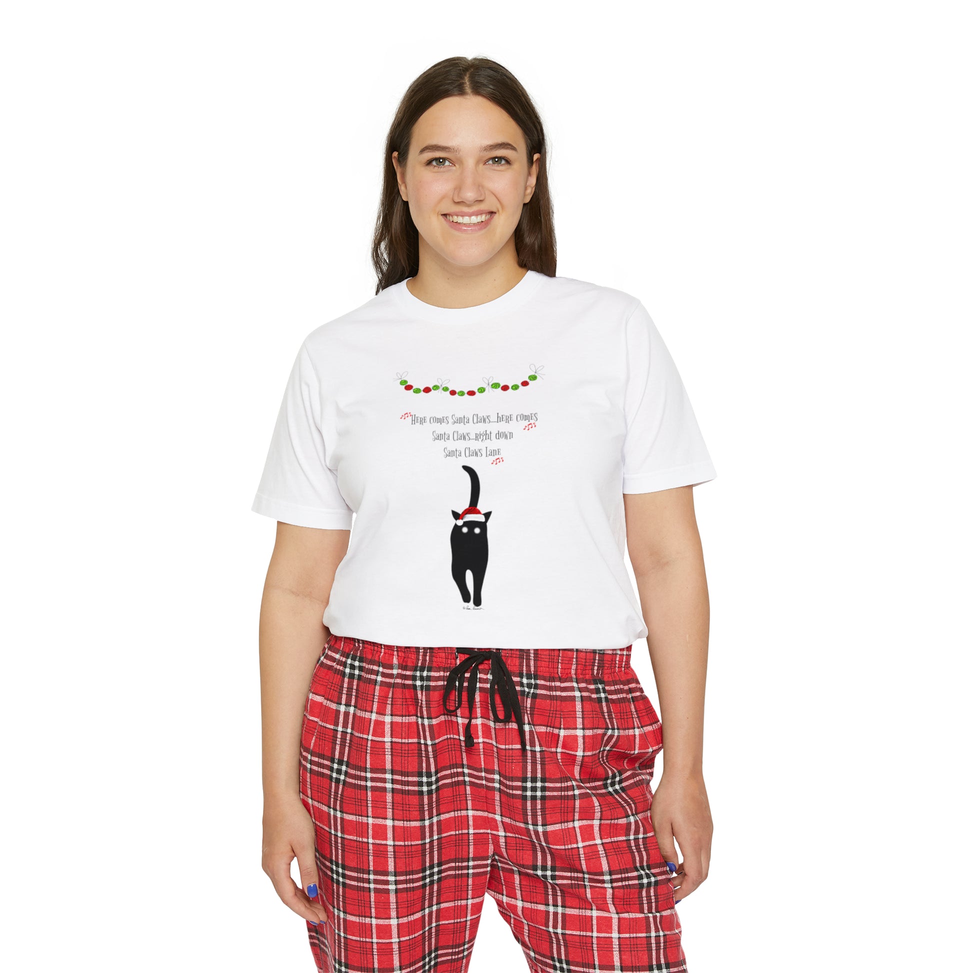 A woman wearing Printify Women's Matching-Family Pajama-Set; 2 piece; Cotton white shirt and red plaid pants.