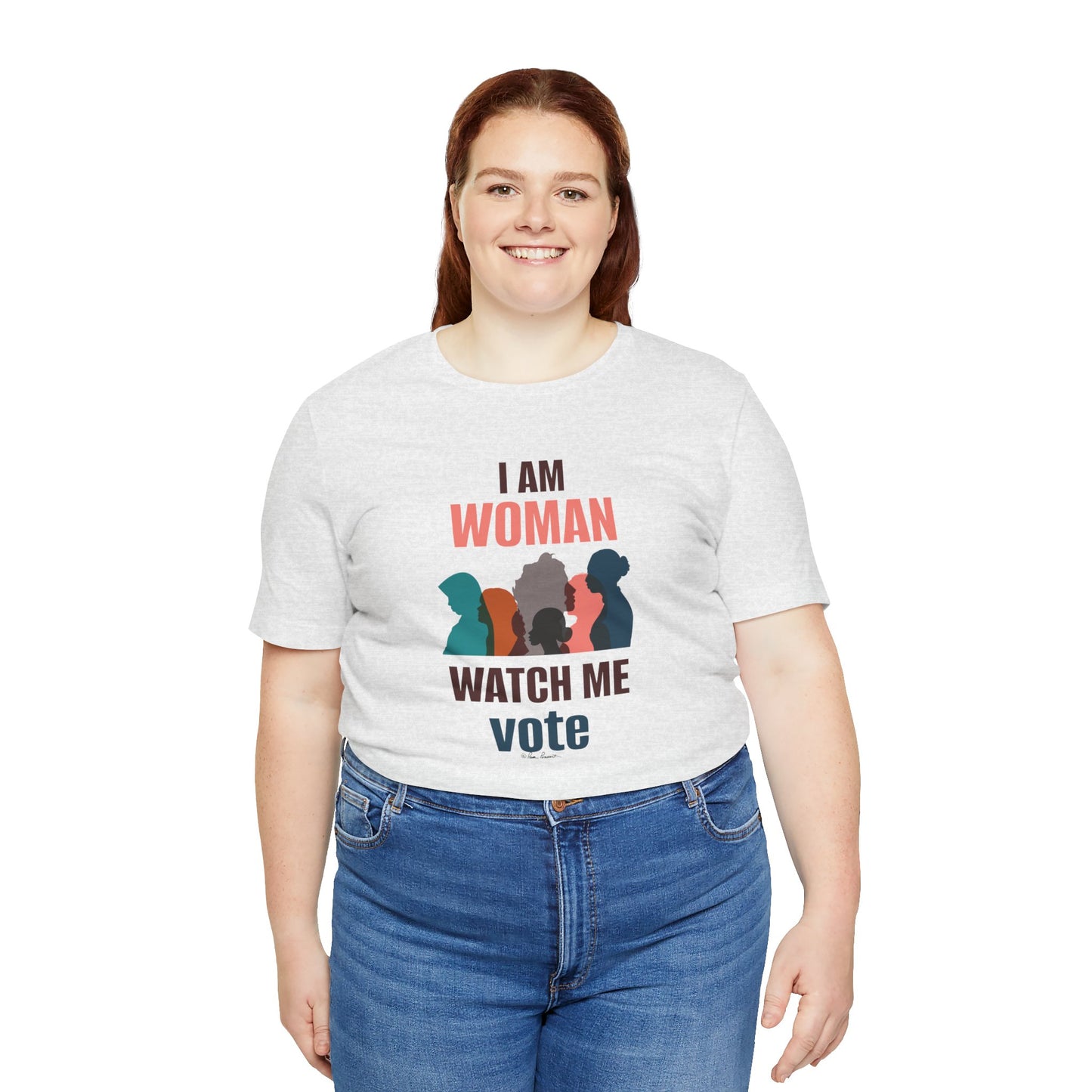Woman in a "Unisex Cotton Jersey T-shirt by Bella+Canvas" with "i am woman watch me vote" and silhouette graphics, paired with blue jeans, smiling at the camera.