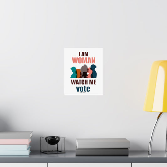A poster on a white wall reads "I AM WOMAN WATCH ME vote" with illustrations of diverse women. Printed with archival inks on museum-grade paper, it hangs above a shelf holding books, a small dish, and a yellow lamp—an inspiring addition to your Voting Womens Posters: 3 sizes; Vertical; Matte finish collection by Printify.