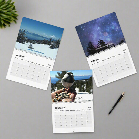 Three pages from the 2025 Scenic Wall Calendar by Printify for January to March are spread out, displaying vibrant snowy landscapes and a starry night sky, ideal for those who value beauty and organization in their planning tools.