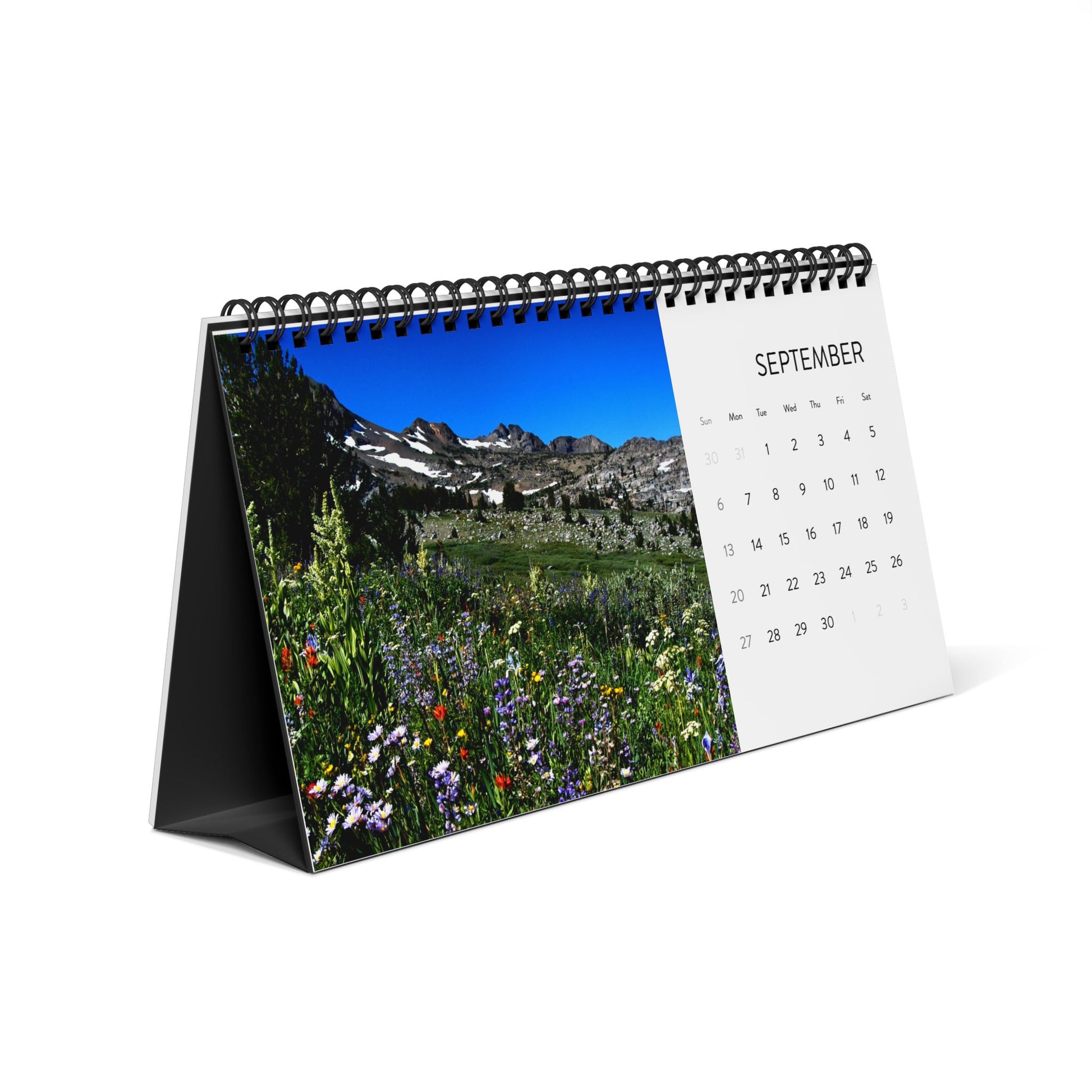 The Printify 2026 Scenic-Landscapes Desktop Calendar displays a vibrant mountain and wildflowers photo for September on the left, with the 12-month calendar grid on the right.