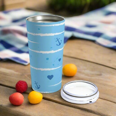 A dishwasher safe, Sailing Love Tumbler: 20 oz.; Stainless steel; Insulated with hearts and anchors on it. (Brand Name: Printify)