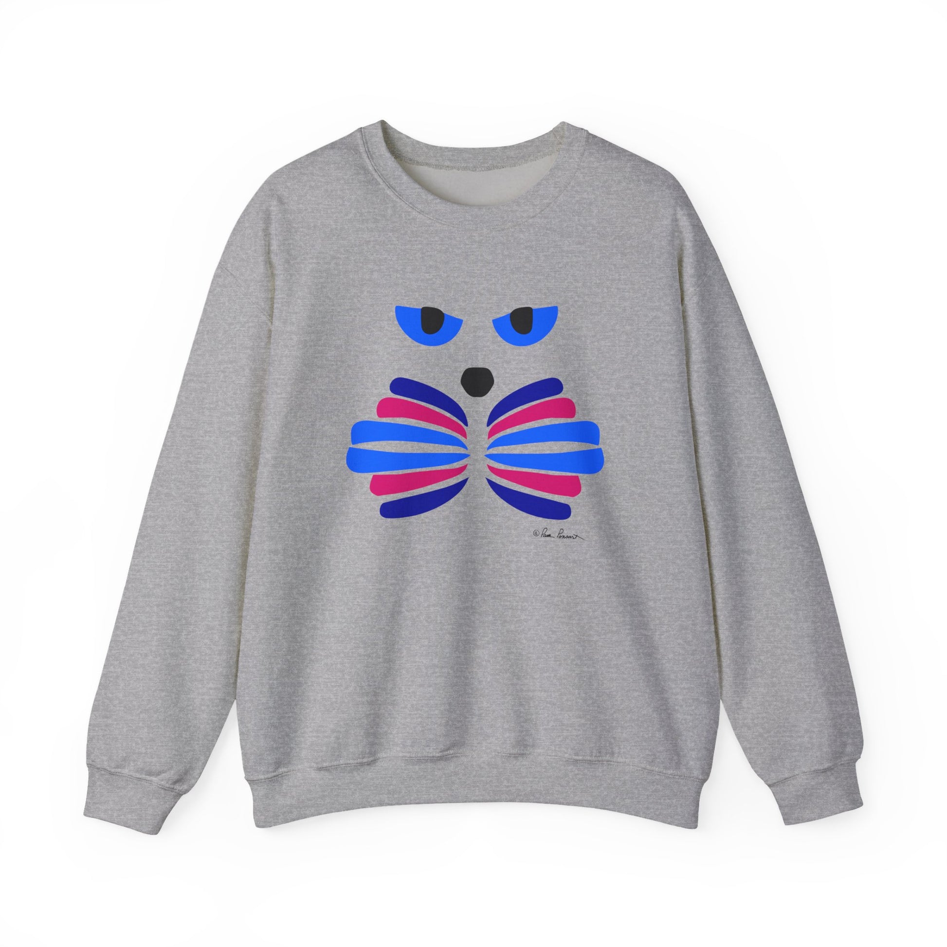 The Whimsical Cat Graphic Sweatshirt by Printify is a unisex crewneck featuring a stylized cat face with blue eyes and abstract blue and pink accents—an artistic and cozy choice for adults.