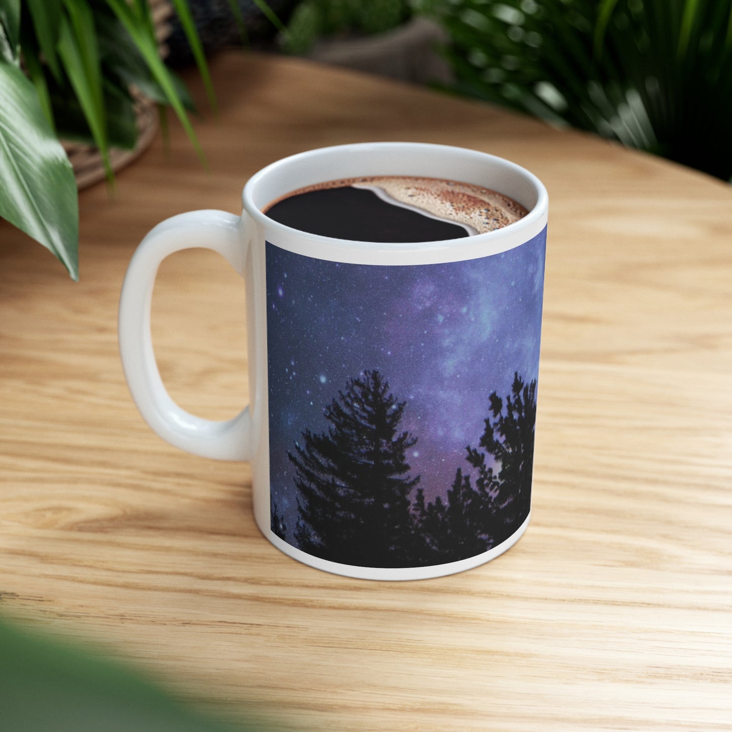 Mock up of the mug filled with a beverage sitting on a wood surface