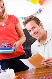 Smiling man reading his card