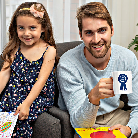 Mock up of a man and his daughter as he holds his Father's Day Mug
