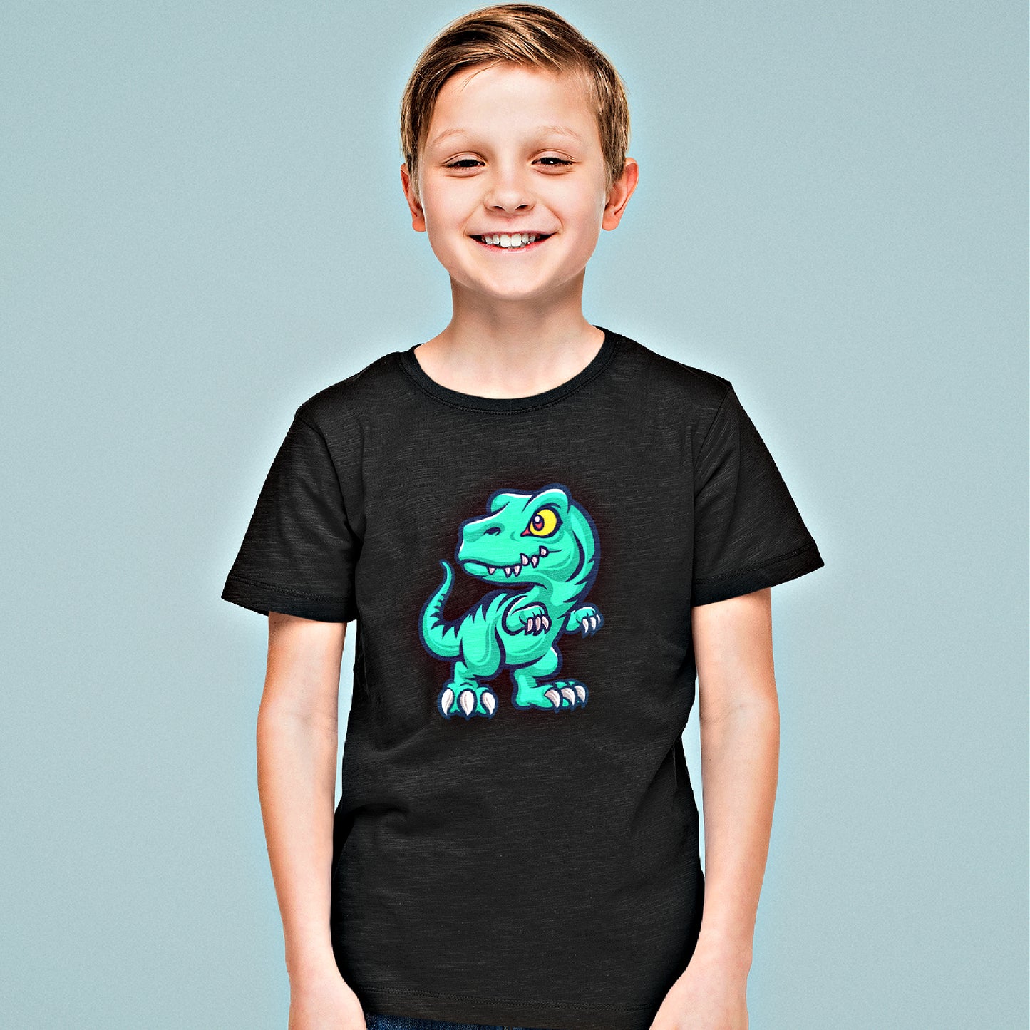 Mock up of smiling boy wearing our black t-shirt
