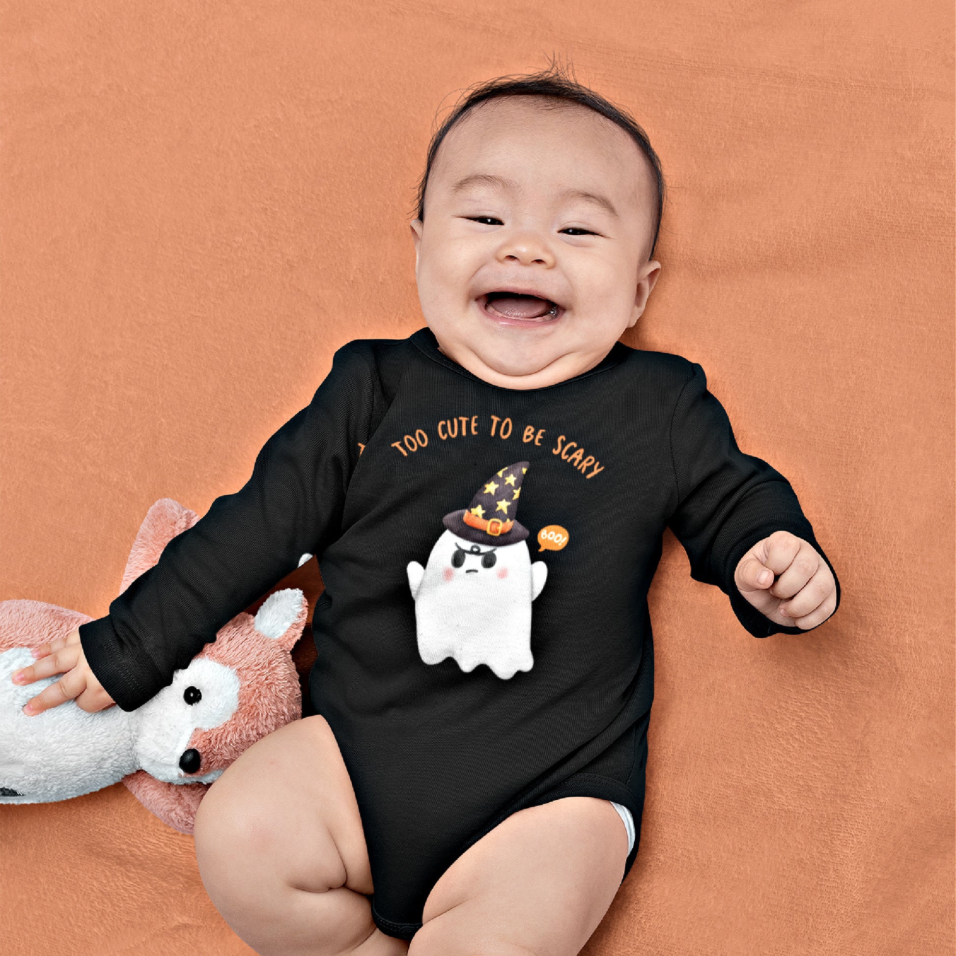 Mock up of a cheerful baby wearing the Black 'onsie'