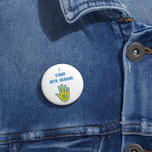 Mock up of the smallest of our Ukrainian-Support Pin Buttons as seen on a denim  shirt