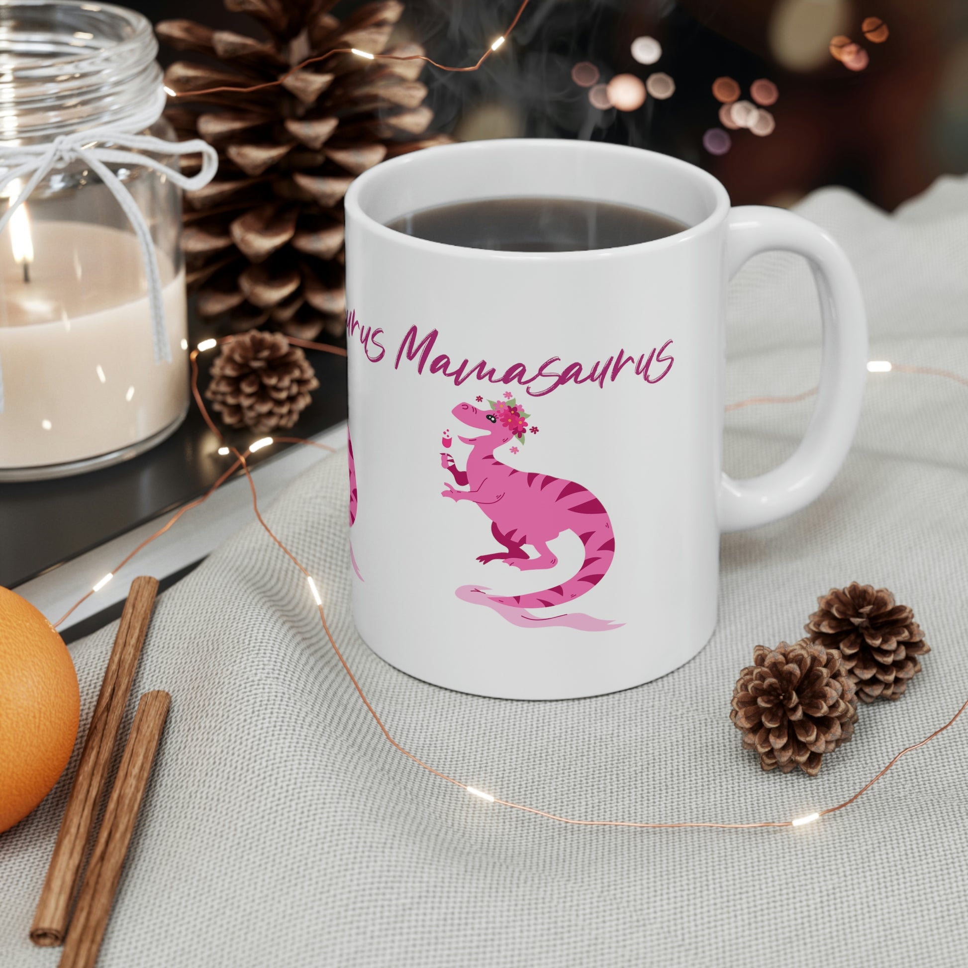Mock up of the mug on a surface surrounded with pine cones and cinnamon sticks