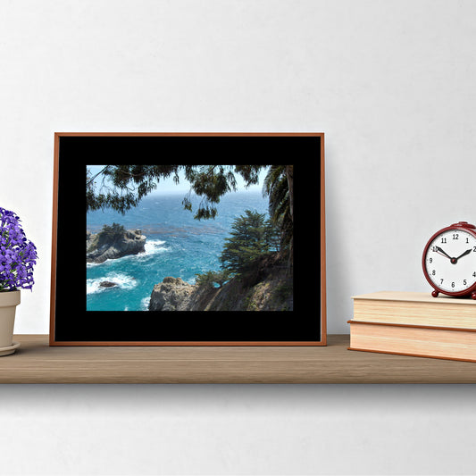 Mock up of our Ocean Blue Seascape surrounded by a black mat and a brown wood frame