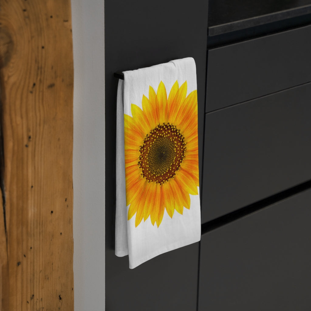 Our Sunflower Kitchen Towel; folded and on a rack next to some drawers