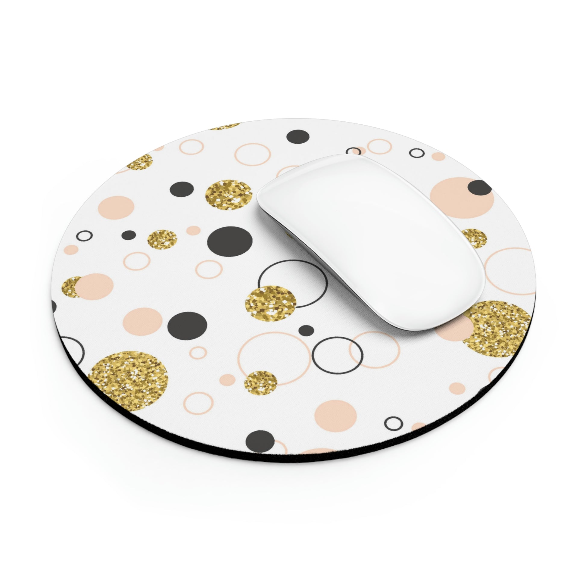 A white computer mouse on a round mouse pad with a white background, featuring a pattern of gold glitter, black, and peach-colored circles. The Printify Round Mouse Pad: Retro design; 1/4" thick; Circles & Dots boasts neoprene construction and a non-slip rubber bottom for enhanced stability.