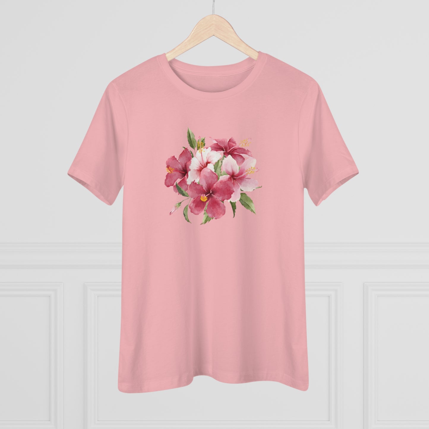 Mock up of our pink t-shirt on a wooden hanger