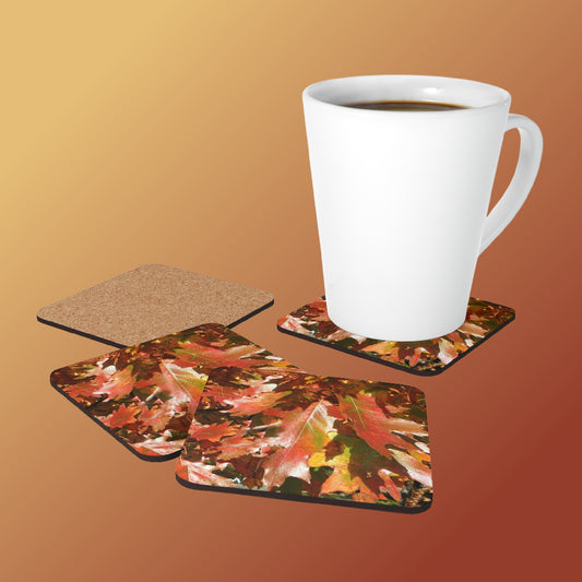 A White latte mug sitting on a coaster with 2 others face-up and 1 face-down