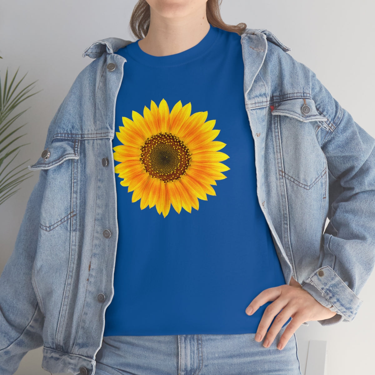 Mock up of woman wearing our royal blue Unisex Sunflower T-shirt